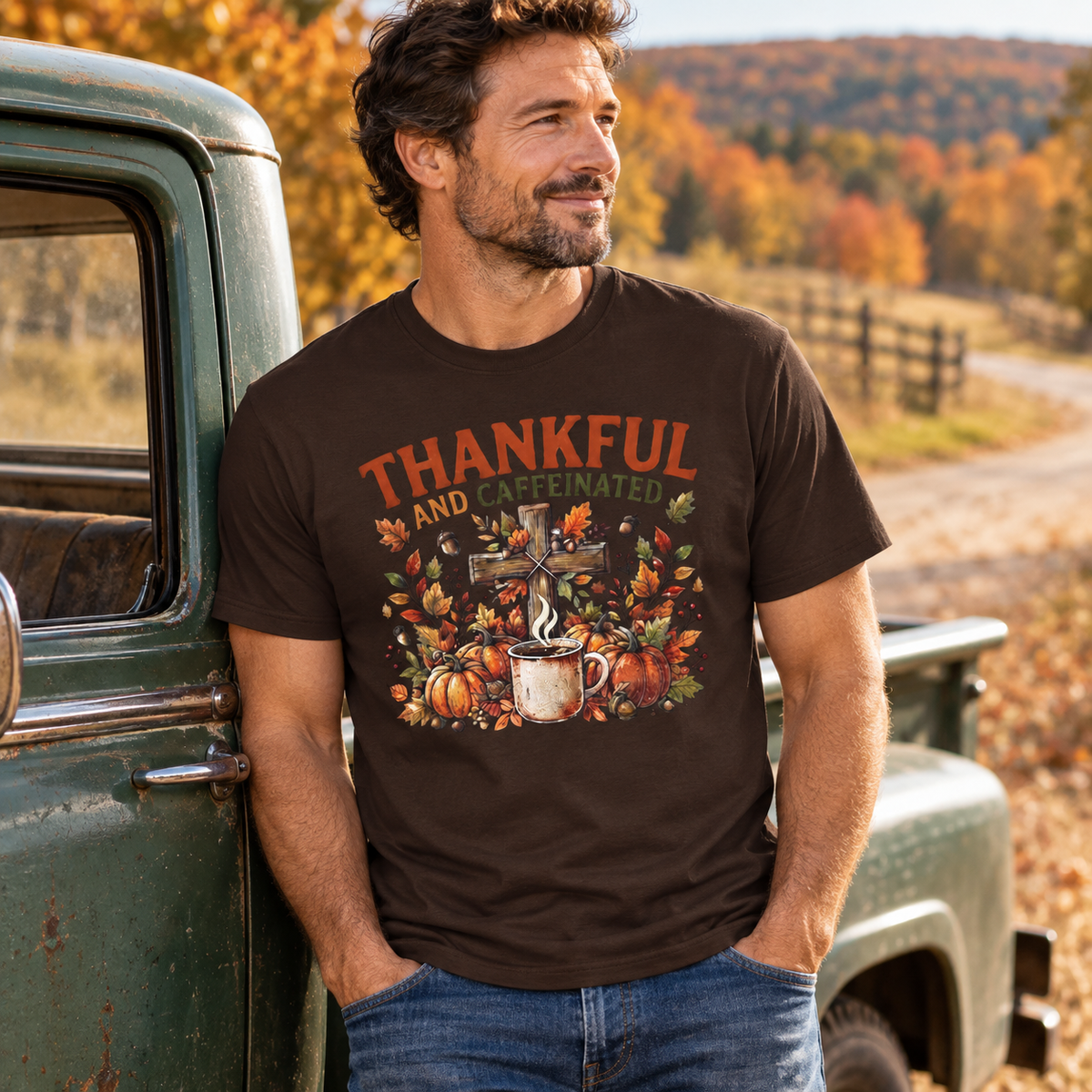 Dark Brown Thankful and Caffeinated Shirt — adult man head to hips beside a muted green vintage pickup on a country road, hands empty