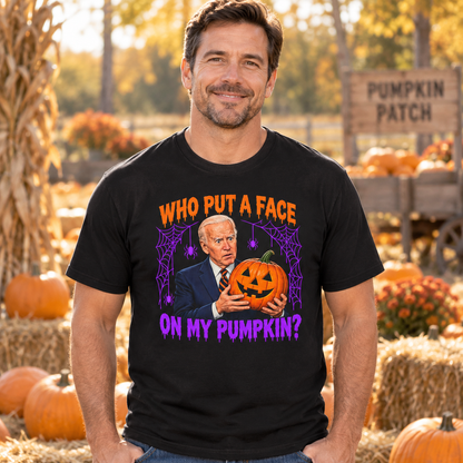 Model wearing the black Joe Biden Halloween pumpkin graphic shirt at a pumpkin patch.