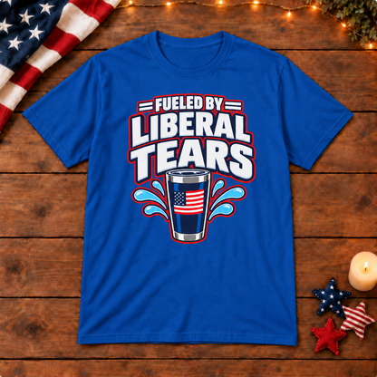 Fueled by Liberal Tears Tumbler Shirt in Royal Blue, on patriotic wooden background