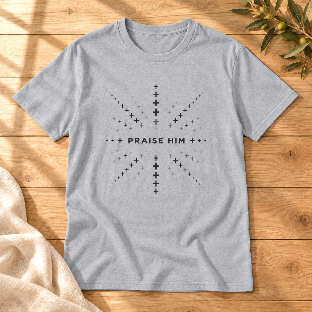 Praise Him T-shirt in Gray on sunlit oak with cream linen and an olive sprig