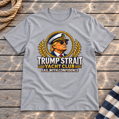 Trump Strait Yacht Club T-shirt in Gray on a styled teak yacht deck with rope and striped linen